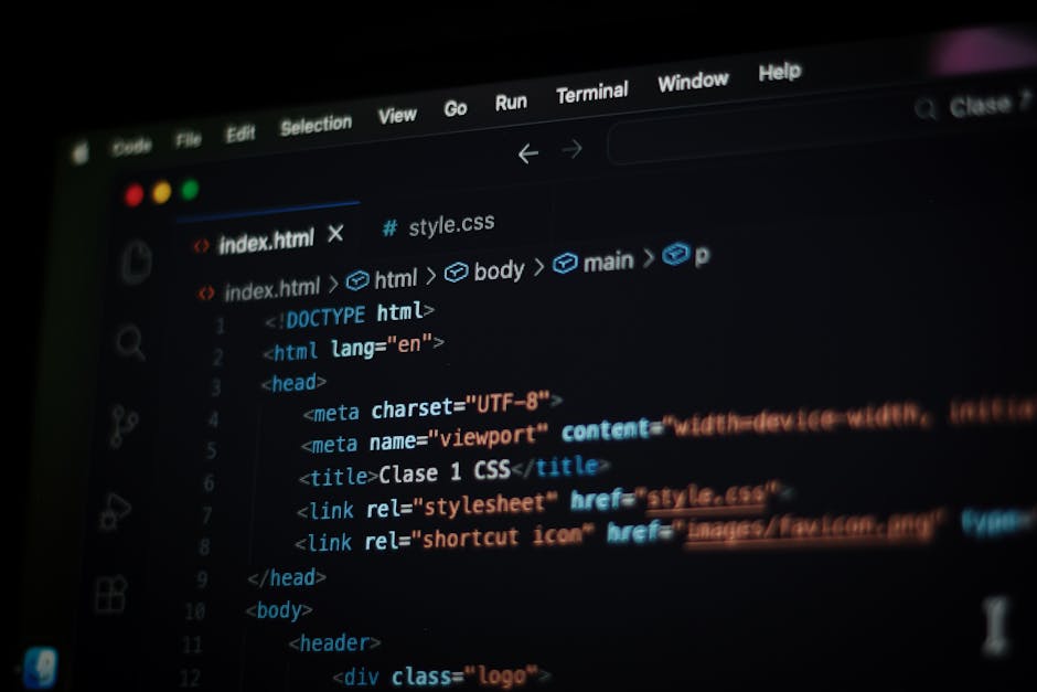 A computer screen displaying a dark-themed code editor with visible HTML and CSS code. The code includes tags such as <html>, <head>, <title>, and <link> with syntax highlighting in various colors lik
